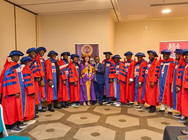 Honorary doctorate recipients in academic gowns at a London Tilcareer Institute ceremony